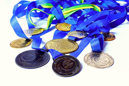 round gold-colored medal thumbnail