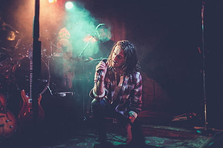 man kneeling while singing thumbnail