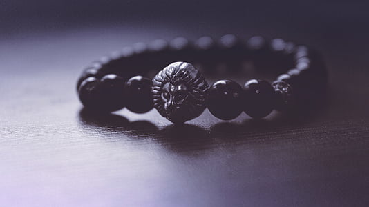beaded black bracelet on wooden surface thumbnail