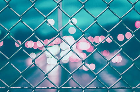 gray chain-link fence bokeh effect photo thumbnail