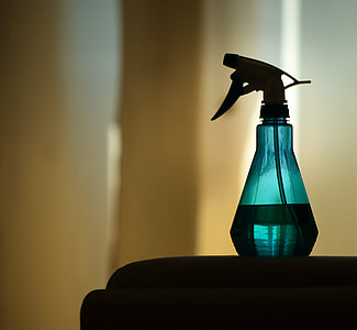 green spray bottle on table thumbnail
