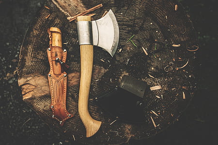Brown Wooden Axe Besides Brown Leather Knife Holster thumbnail