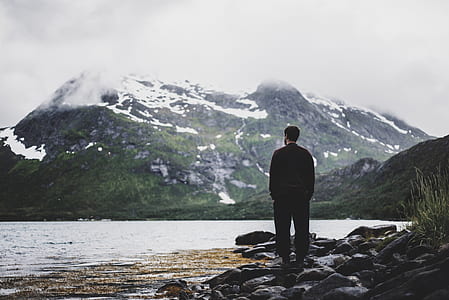 man standing on stone beside the seshore thumbnail