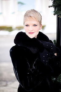 woman in black coat in focus photography thumbnail