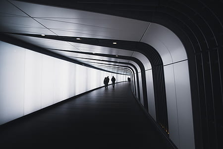people walking narrow pathway thumbnail