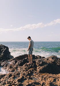 man standing near shore thumbnail