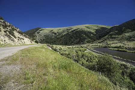 Hills, road, landscape, and river in Montana thumbnail