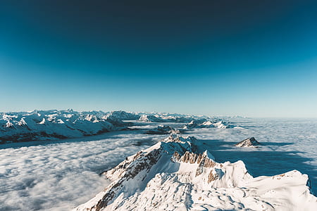 mountain peal under blue sky thumbnail