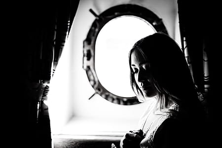 woman standing near curtain thumbnail