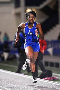 soft focus photography of running woman in blue Nike tank top and shorts thumbnail