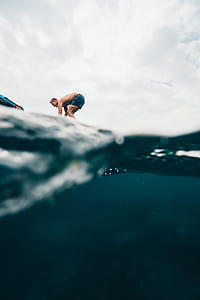 surfer on body of water thumbnail