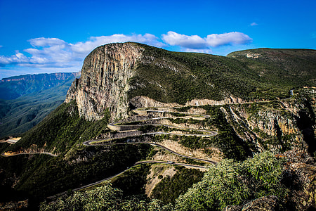 green and brown mountain under blue sky thumbnail