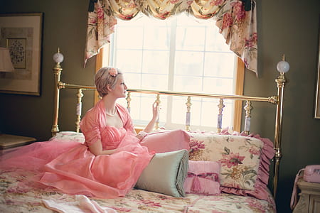 woman sitting on bed thumbnail