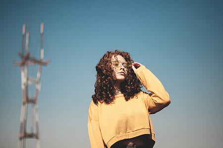 woman fixing aviator sunglasses thumbnail