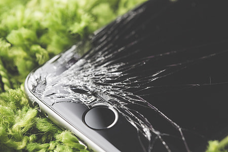 Dropped iPhone 6 with Cracked Screen Close Up thumbnail