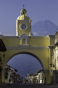 yellow concrete tower clock during daytime thumbnail