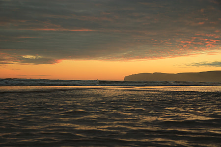 sunset over the horizon photo thumbnail