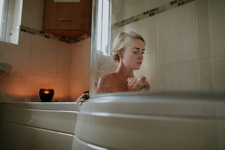 woman on bathtub inside the room thumbnail