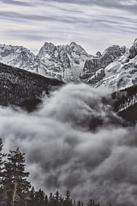 silhouette photo of mountains covered with snow thumbnail