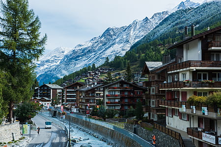concrete building near the foot of mountain thumbnail
