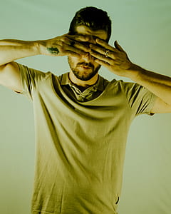 man covering his face with both hands thumbnail