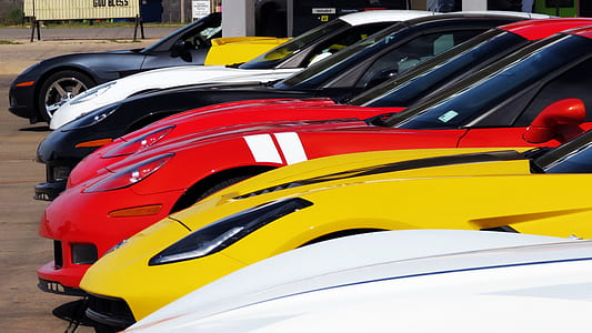 sports cars on parking lot thumbnail