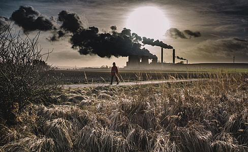 photo of person walking pathway near silo thumbnail
