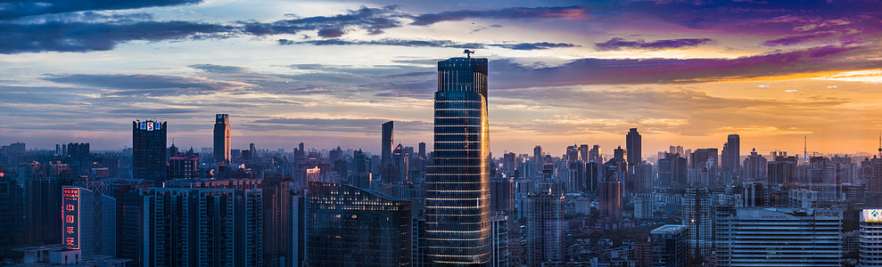 city buildings under cloudy sky during daytime thumbnail