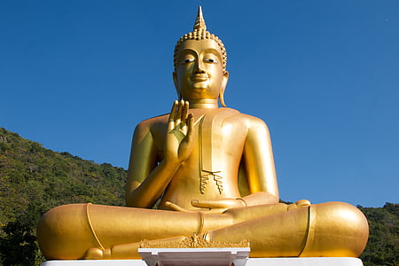 gold-colored buddha under blue sky during daytime thumbnail