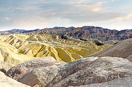 yellow and grey rocky mountain top during daytime thumbnail