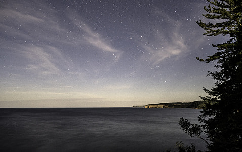 Stars above the night landscape at Pictured Rocks National Lakeshore, Michigan thumbnail