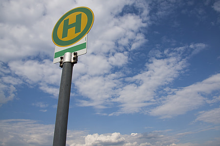 green and white H sign post thumbnail