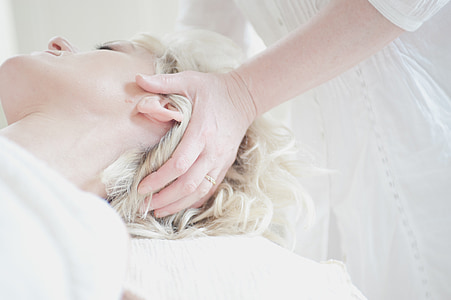 person in white top doing massage thumbnail