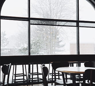 dining tables and chairs near glass wall thumbnail