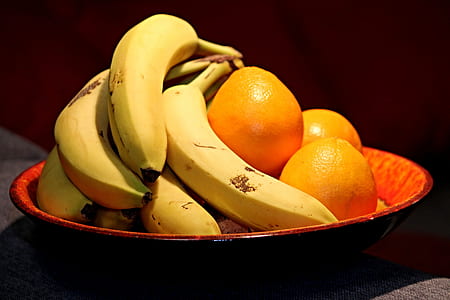 assorted fruits in round black ceramic bowl thumbnail