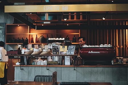 man standing inside Espresso bar thumbnail