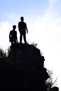 silhouette of two person on hill thumbnail