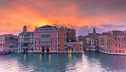 red and gray concrete buildings during sunset thumbnail