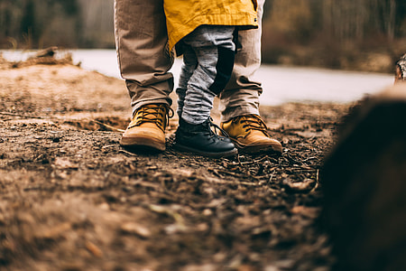 person wearing gray pants and brown shoes thumbnail