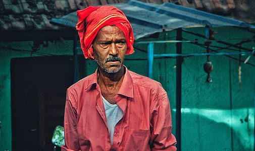 man wearing red dress shirt and red turban thumbnail