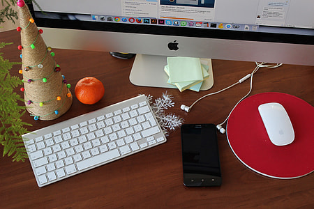 black android smartphone beside apple magic mouse and apple wireless keyboard and silver imac thumbnail