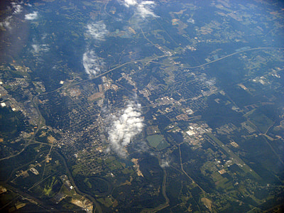 Aerial View with clouds and town underneath in Columbus, Mississippi thumbnail