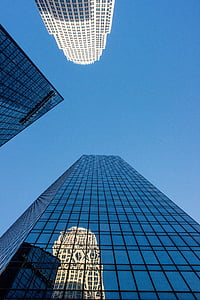 curtain-wall buildings under blue sky thumbnail