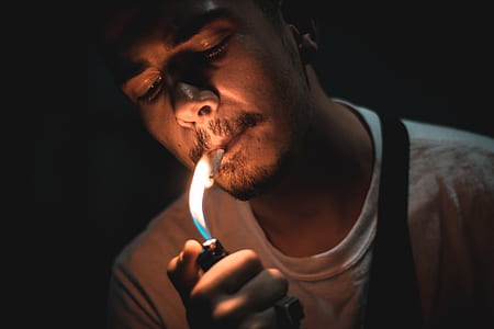 person lighting cigarette thumbnail