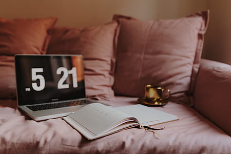 Workplace with a laptop on a pink couch thumbnail