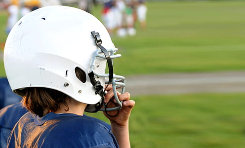 person wearing white NFL helmet thumbnail