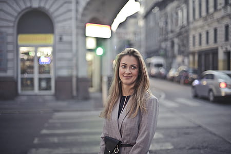 Woman in Gray Suit Jacket Near Gray Car thumbnail