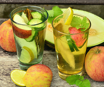 two clear drinking glasses with full of fruit salads thumbnail