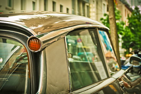 close-up photography of gray vehicle during daytime thumbnail