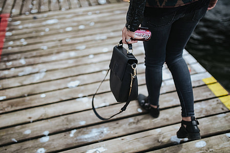 Beautiful blonde woman on a wooden pier by the lake thumbnail